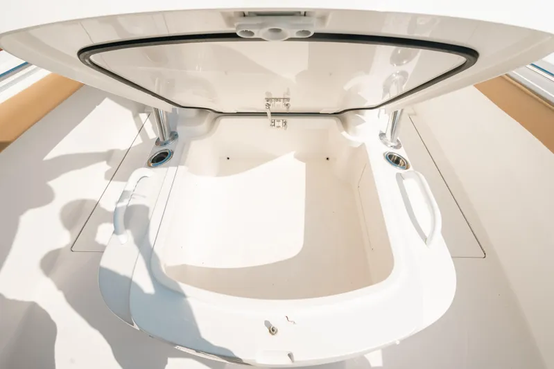  Yacht Photos Pics Open storage compartment on 2020 Valhalla Boatworks V-33 boat, showcasing interior space.