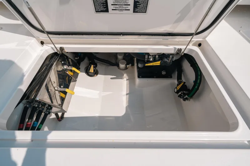  Yacht Photos Pics 2020 Valhalla Boatworks V-33 storage compartment with mechanical components visible.