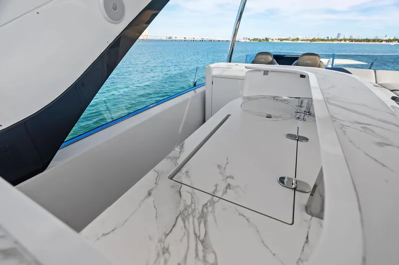  Yacht Photos Pics Luxurious 2021 Azimut Fly 78 yacht with elegant marble countertop and ocean view.