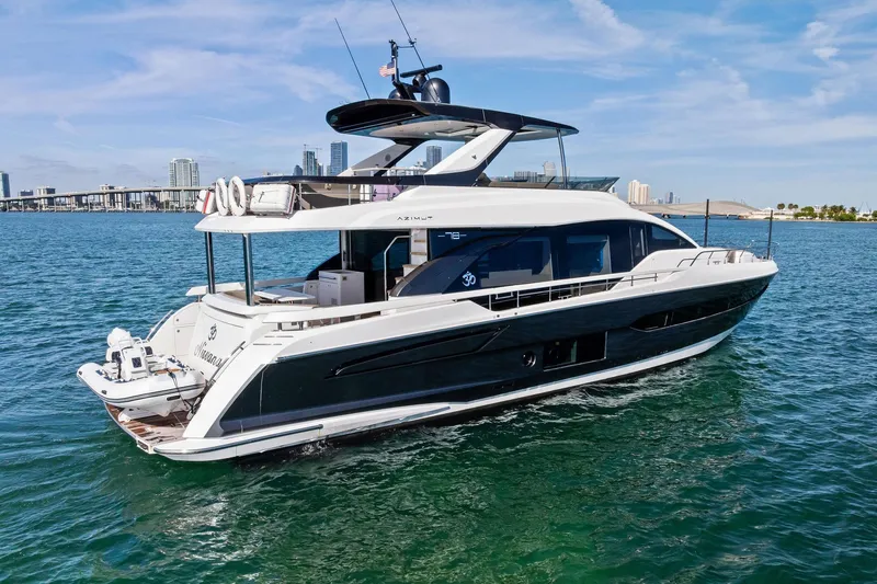  Yacht Photos Pics Luxury 2021 Azimut Fly 78 yacht cruising in clear blue waters.