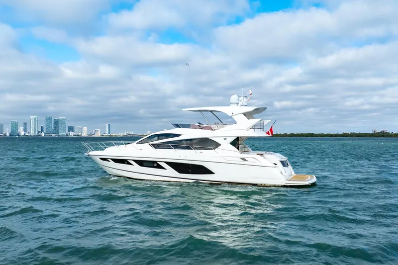  Yacht Photos Pics 2016 Sunseeker Manhattan 65 yacht cruising on open water.