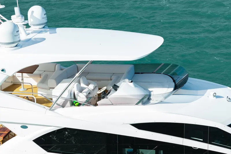  Yacht Photos Pics Sunseeker Manhattan 65 yacht, 2016 model, cruising on blue waters.