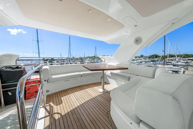  Yacht Photos Pics Luxurious 2016 Sunseeker Manhattan 65 yacht with spacious deck and marina view.
