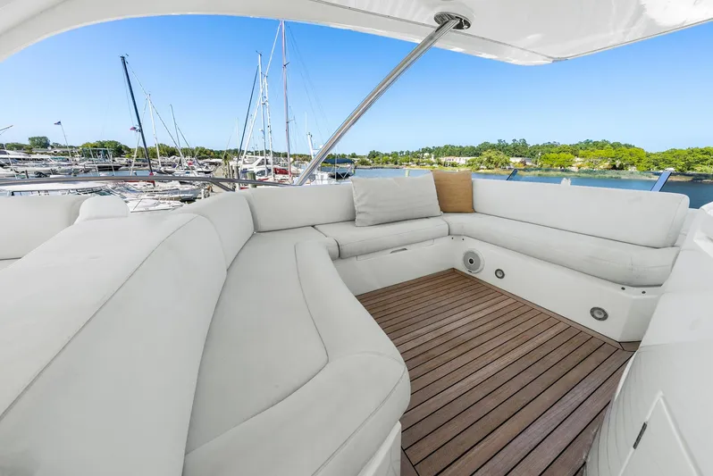  Yacht Photos Pics Luxurious seating area on 2016 Sunseeker Manhattan 65 yacht, docked at marina.