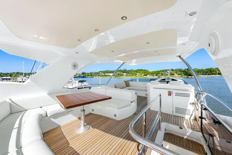  Yacht Photos Pics Luxurious Sunseeker Manhattan 65 yacht interior, 2016 model, featuring elegant seating and scenic views.