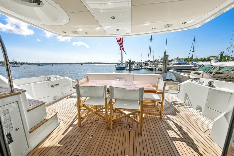  Yacht Photos Pics Sunseeker Manhattan 65 yacht deck with seating, overlooking marina, 2016 model.