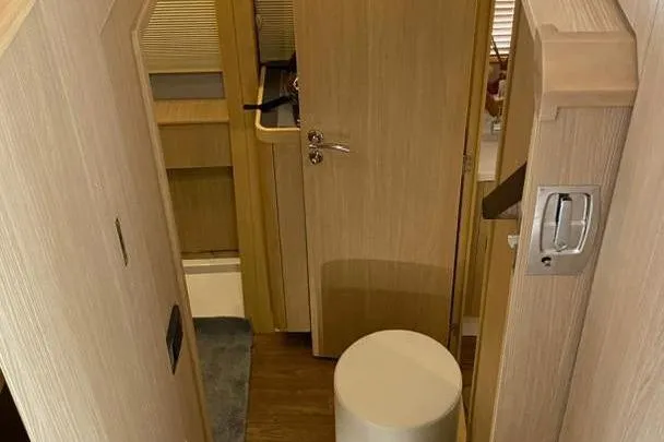  Yacht Photos Pics Interior of 2023 Aquila 42 yacht featuring wooden cabinetry and modern design elements.