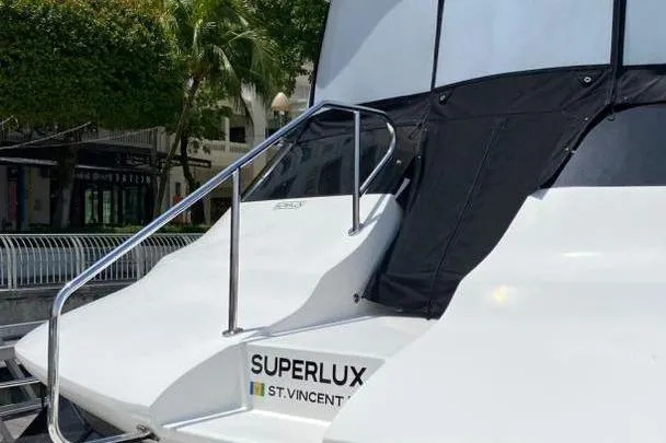  Yacht Photos Pics Aquila 42 yacht "Superlux" docked, featuring sleek design and modern aesthetics, 2023 model.