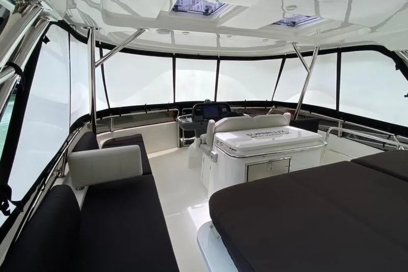  Yacht Photos Pics Luxurious interior of 2023 Aquila 42 yacht with modern seating and navigation area.