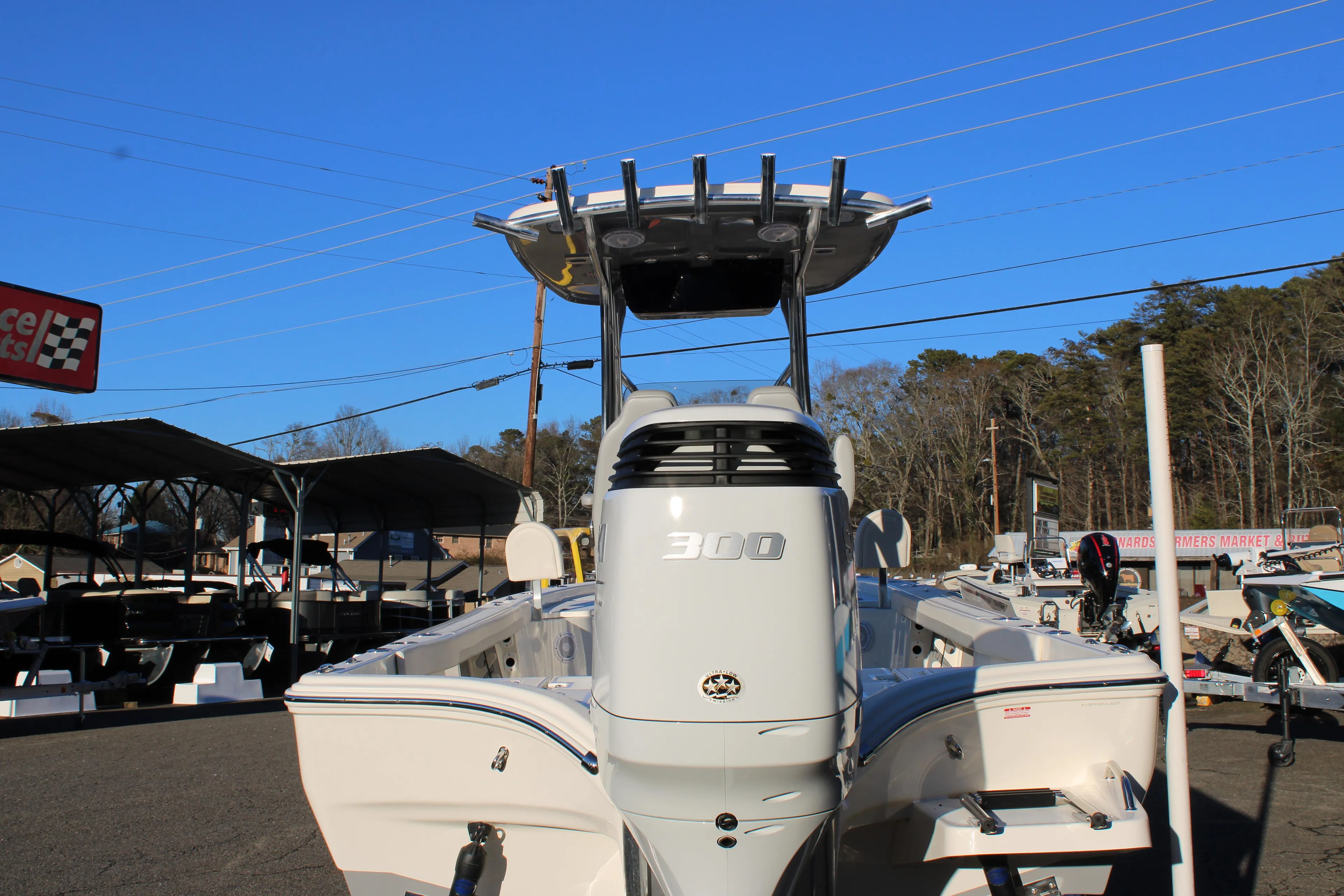 2025 Avenger AV26 boat with 300 horsepower engine, parked outdoors.