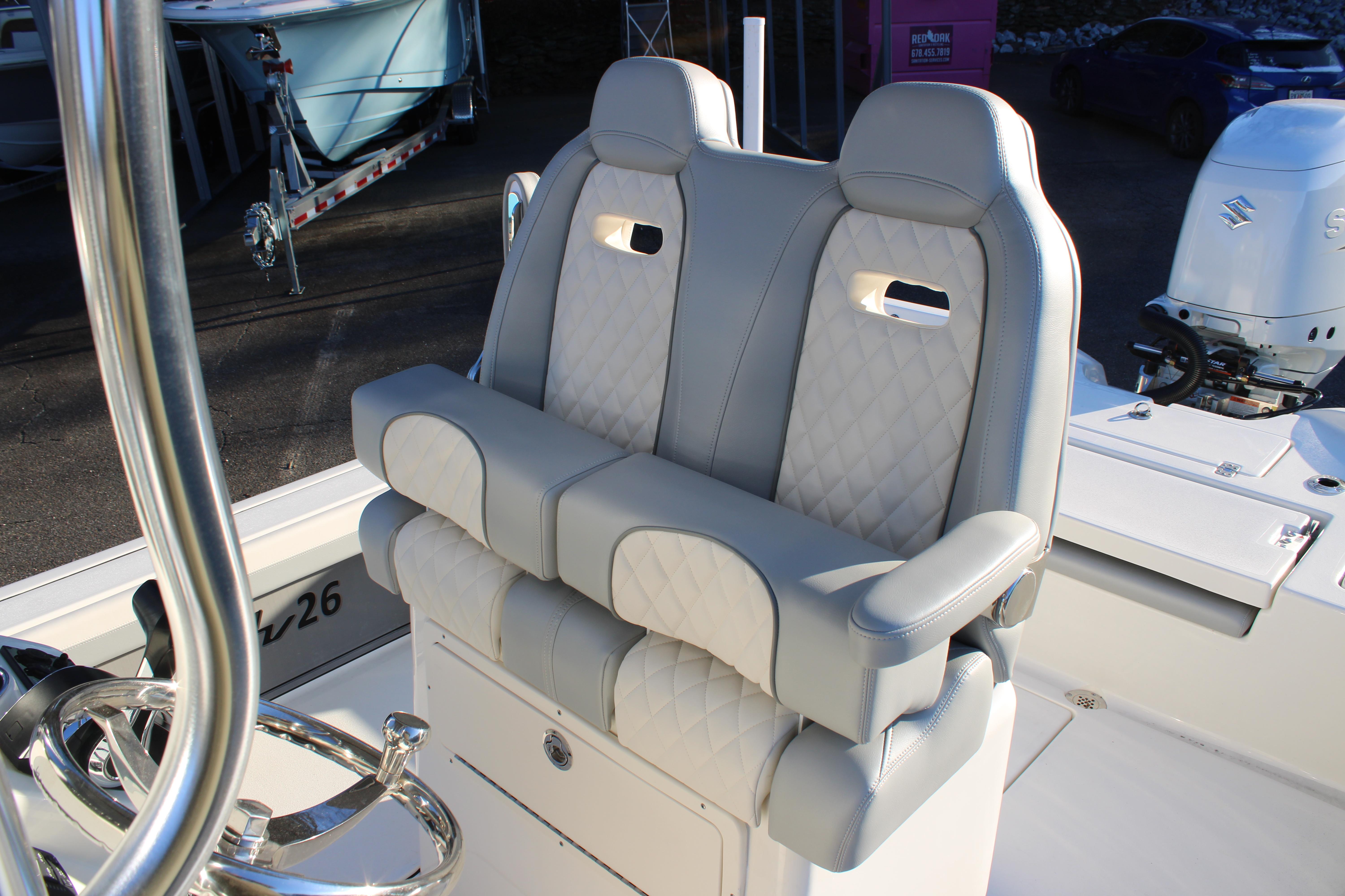 Luxury seating on 2025 Avenger AV26 boat with quilted upholstery and armrests.
