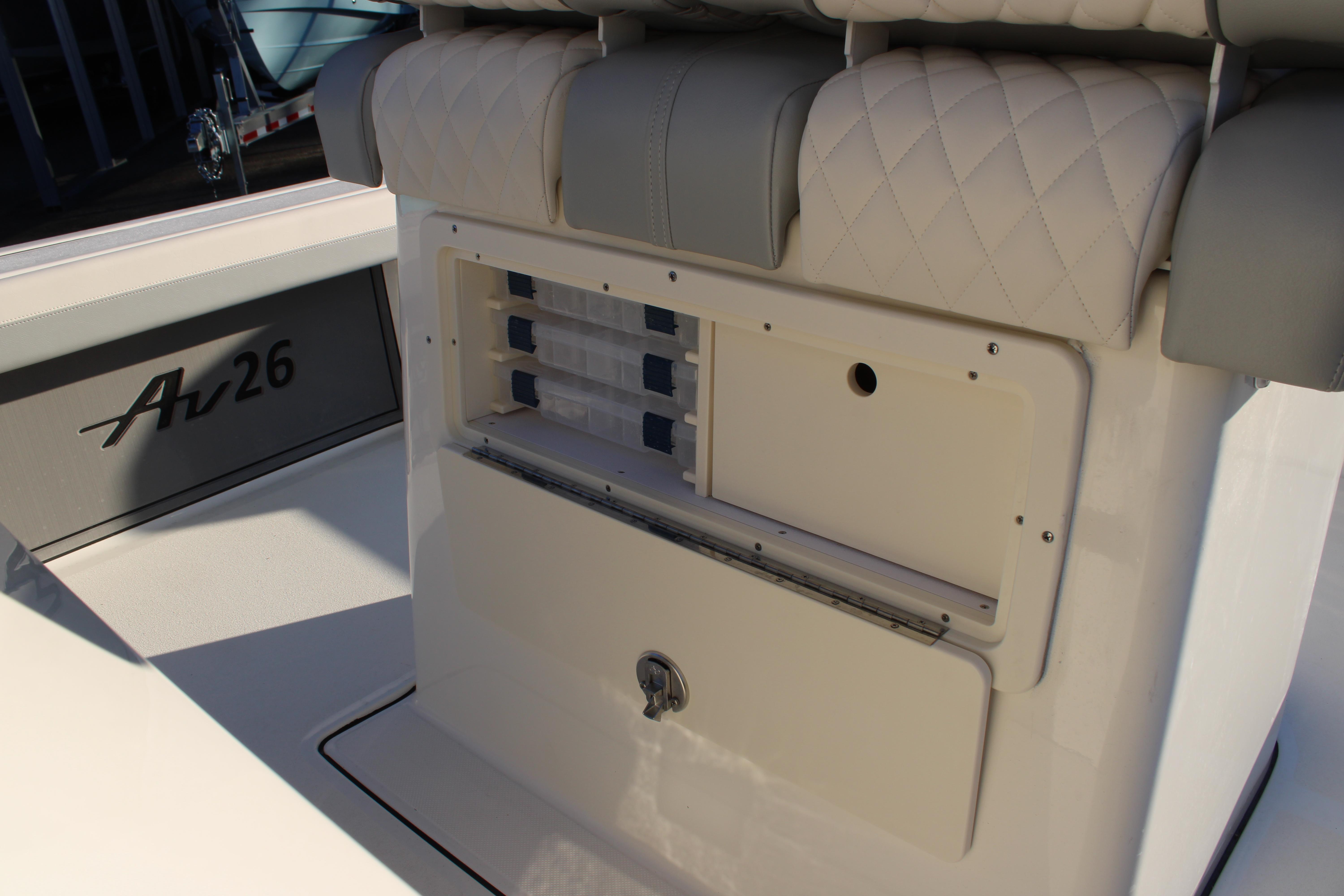 Avenger AV26 2025 boat interior with storage compartment and seating.