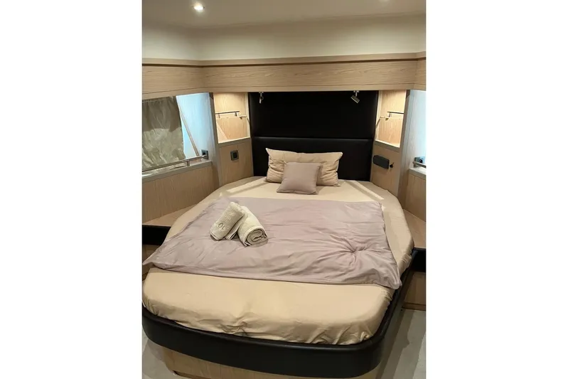 Odoo Id - 2.110 Yacht Photos Pics Luxurious bedroom interior of 2021 Beneteau Swift Trawler 50 with cozy bedding.