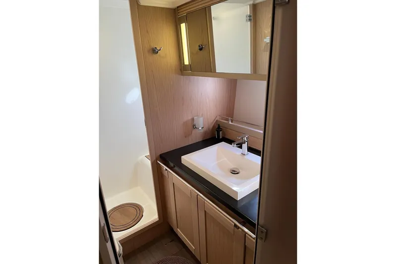 Odoo Id - 2.110 Yacht Photos Pics Bathroom interior of 2021 Beneteau Swift Trawler 50 with modern sink and shower.