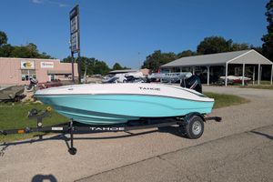 2026 Tahoe T16 boat on trailer at dealership, sunny day.