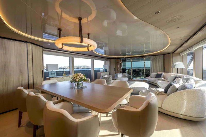 Unique S Yacht Photos Pics Luxurious interior of 2024 Sanlorenzo SD118 yacht with elegant dining and seating area.