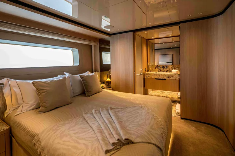 Unique S Yacht Photos Pics Luxurious bedroom interior of 2024 Sanlorenzo SD118 yacht with elegant decor and en-suite bathroom.