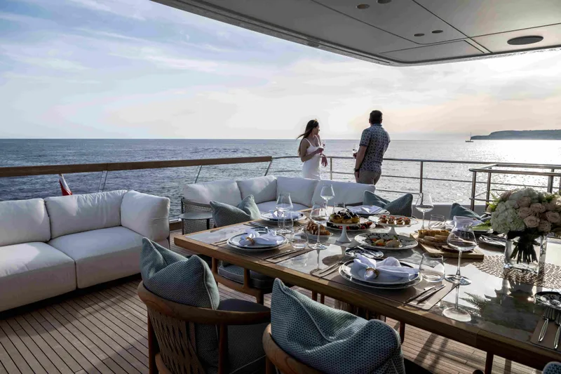 Unique S Yacht Photos Pics Luxurious 2024 Sanlorenzo SD118 yacht deck with elegant dining setup and ocean view.