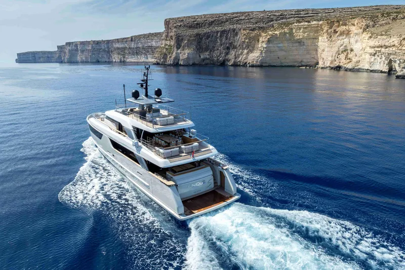 Unique S Yacht Photos Pics Luxury 2024 Sanlorenzo SD118 yacht cruising near scenic cliffs.