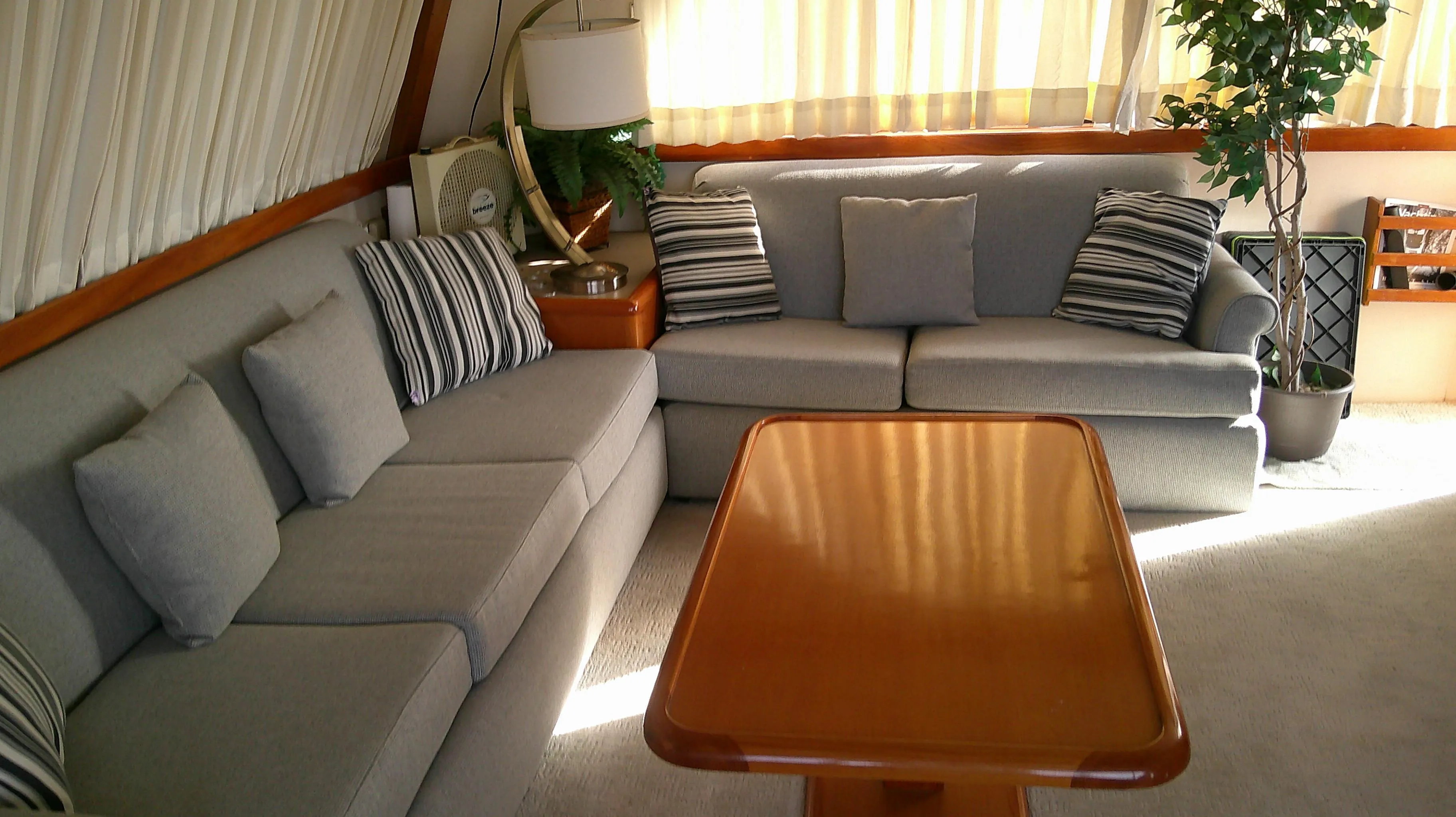 Luxurious interior of a 1996 Ocean Alexander 546 Yachtfisher with elegant seating and decor.