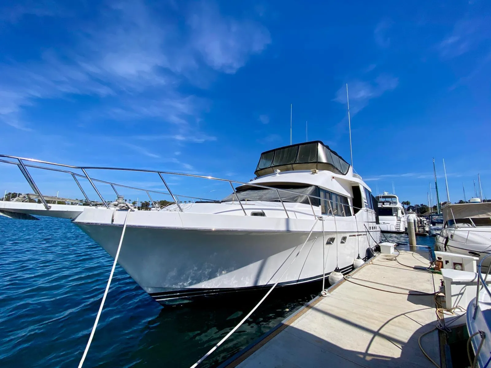 Ocean Alexander 546 Yachtfisher 1996 docked under clear blue sky.