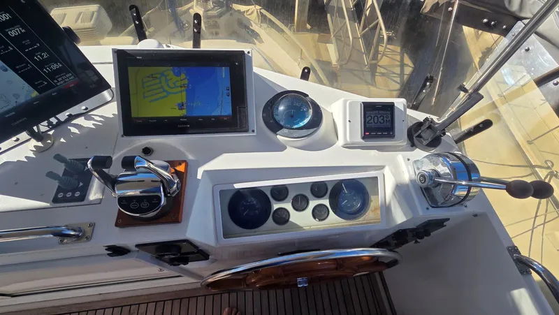 Cinsubar II Yacht Photos Pics Helm of the 1997 Grand Banks 49 Classic yacht.