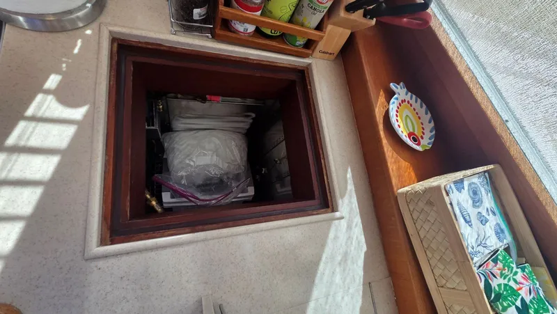 Cinsubar II Yacht Photos Pics Interior of a 1997 Grand Banks 49 Classic with storage compartment.