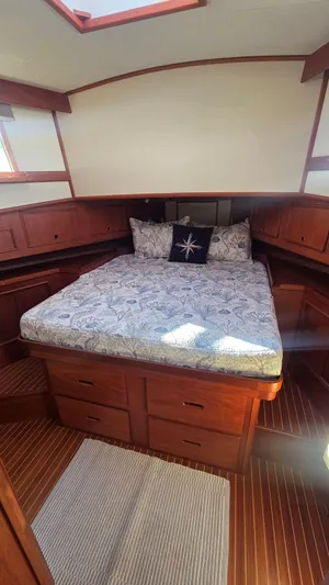 Cinsubar II Yacht Photos Pics Interior of a 1997 Grand Banks 49 Classic yacht with cozy bedroom.