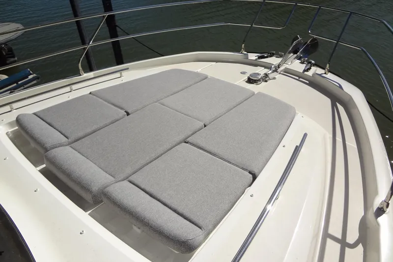 Dream Big Yacht Photos Pics 2023 Prestige 420S yacht with cushioned sunbathing area on deck.