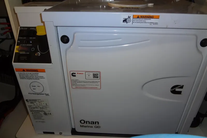 Dream Big Yacht Photos Pics 2023 Prestige 420S featuring Onan Marine QD generator with Cummins branding and safety warnings.