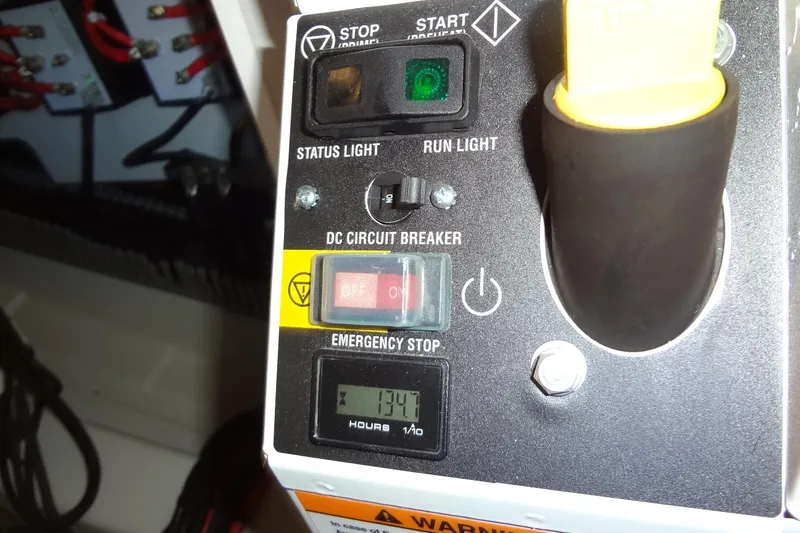 Dream Big Yacht Photos Pics Control panel of a 2023 Prestige 420S with status lights and emergency stop.