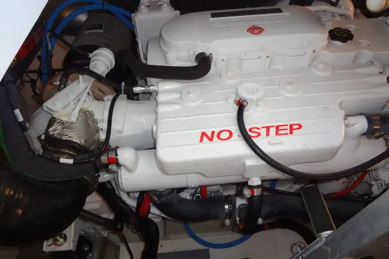 Dream Big Yacht Photos Pics Engine compartment of 2023 Prestige 420S with "No Step" warning label.