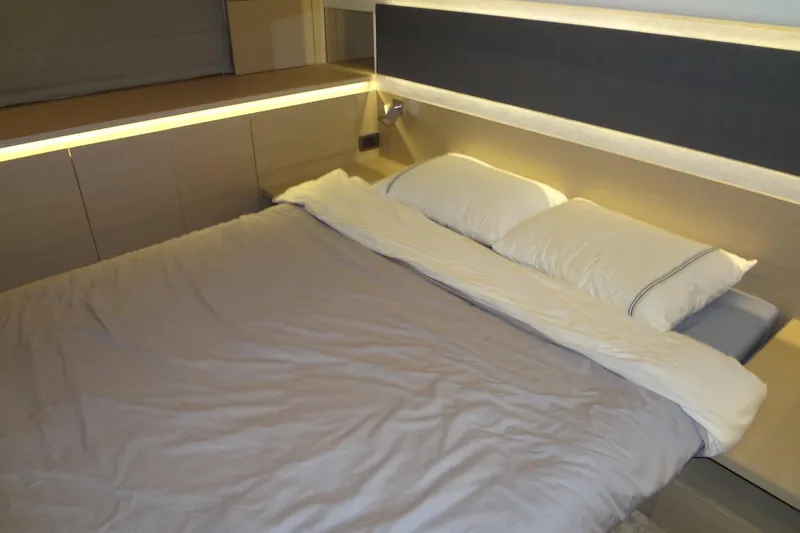 Dream Big Yacht Photos Pics Luxurious 2023 Prestige 420S yacht bedroom with modern lighting and elegant bedding.