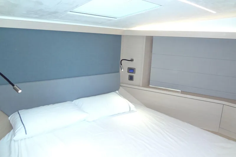 Dream Big Yacht Photos Pics Luxurious bedroom interior of 2023 Prestige 420S yacht with modern design and lighting.