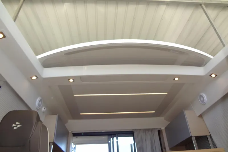 Dream Big Yacht Photos Pics Interior view of 2023 Prestige 420S yacht with modern ceiling design and lighting.