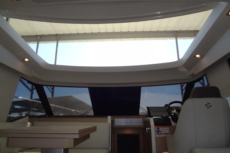 Dream Big Yacht Photos Pics Interior view of 2023 Prestige 420S yacht with modern helm and seating area.