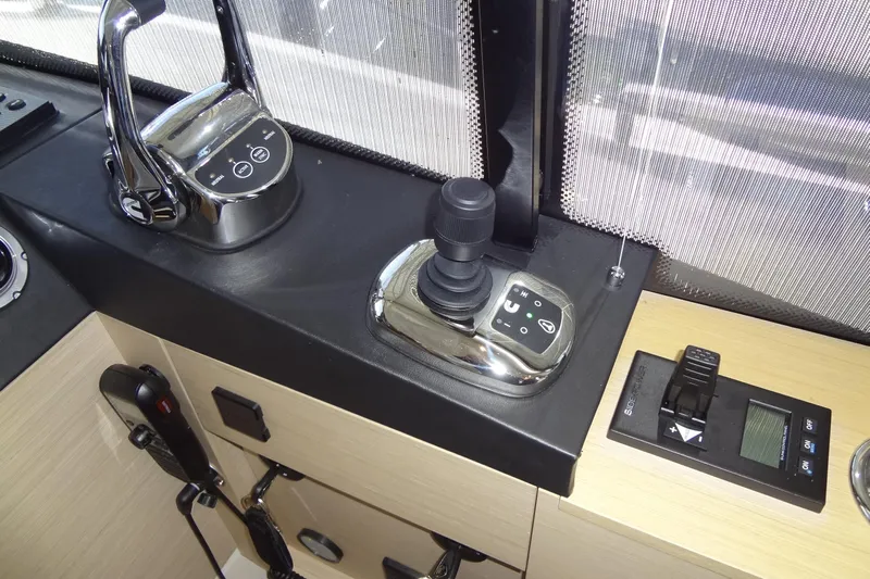 Dream Big Yacht Photos Pics Control panel of 2023 Prestige 420S yacht with joystick and throttle levers.