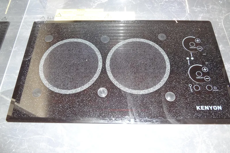 Dream Big Yacht Photos Pics 2023 Prestige 420S Kenyon cooktop with dual burners and control knobs.