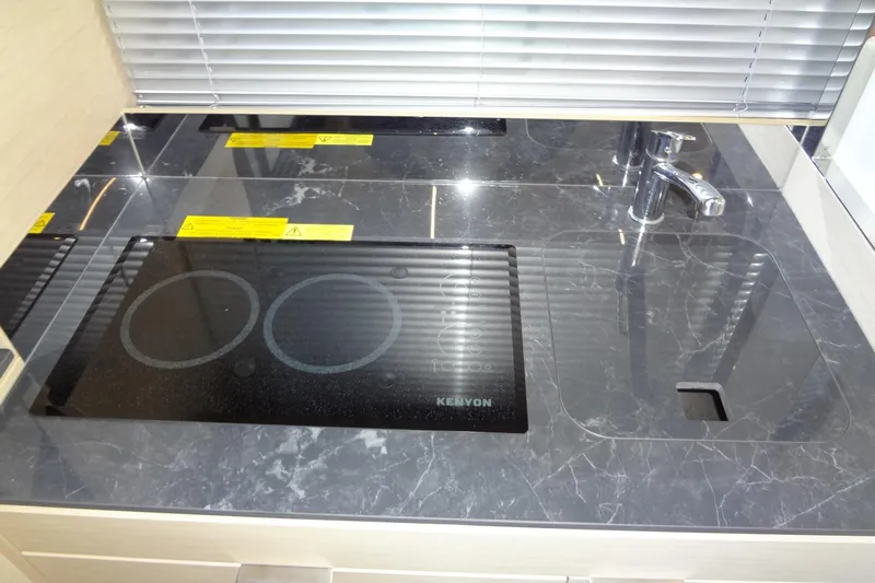 Dream Big Yacht Photos Pics Modern kitchen in 2023 Prestige 420S yacht with sleek stovetop and sink.