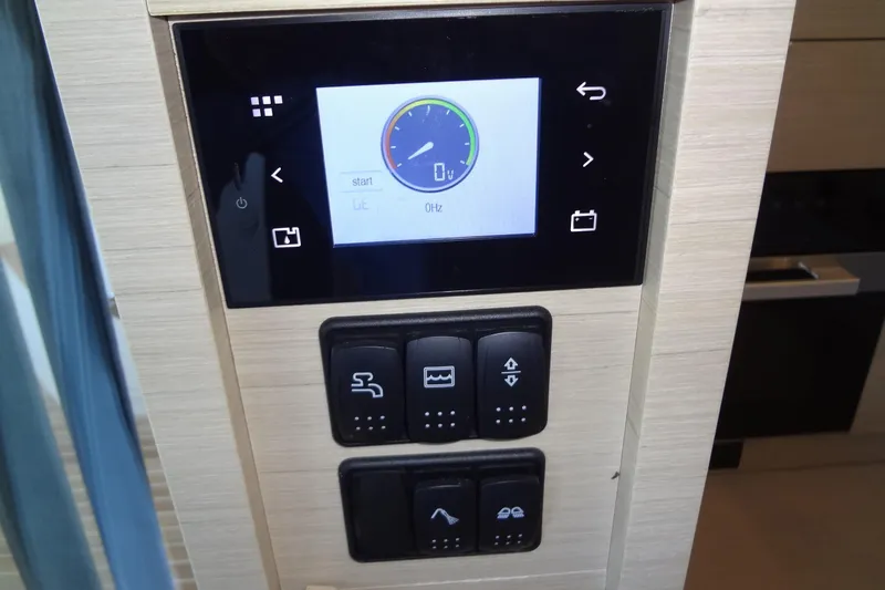 Dream Big Yacht Photos Pics Control panel of 2023 Prestige 420S yacht with digital display and buttons.