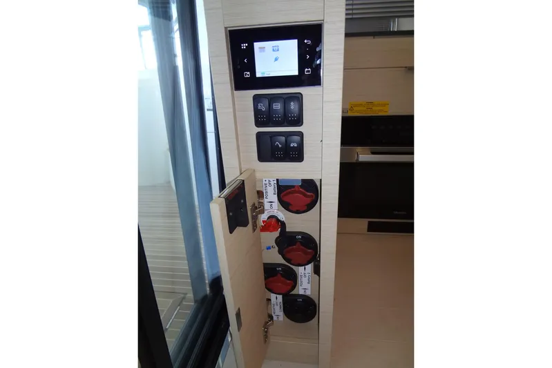Dream Big Yacht Photos Pics Control panel inside 2023 Prestige 420S yacht, featuring switches and digital display.