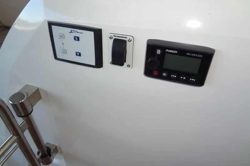 Dream Big Yacht Photos Pics Control panel on 2023 Prestige 420S yacht featuring Fusion MS-NRX300 and Glendinning controls.