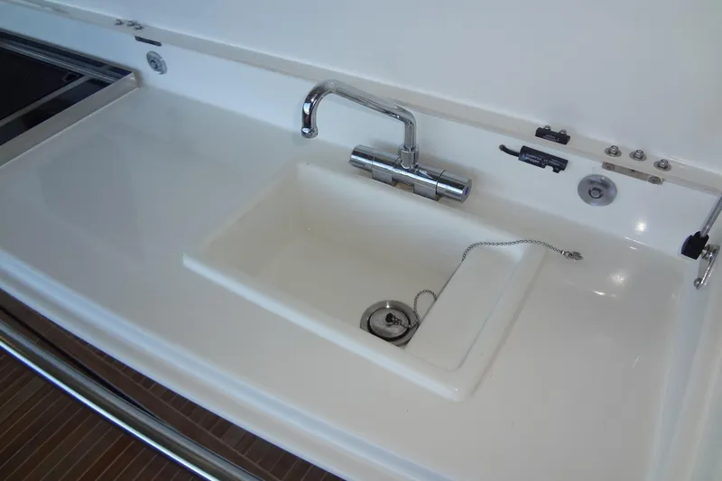 Dream Big Yacht Photos Pics Modern sink on 2023 Prestige 420S yacht, featuring sleek chrome faucet and integrated design.