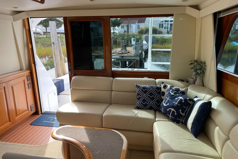 Tiramisu Yacht Photos Pics Luxurious interior of 1996 Viking 47 Convertible yacht with elegant seating and nautical decor.