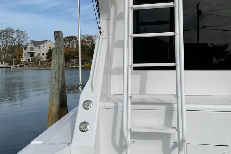 Tiramisu Yacht Photos Pics 1996 Viking 47 Convertible yacht docked by waterfront homes.