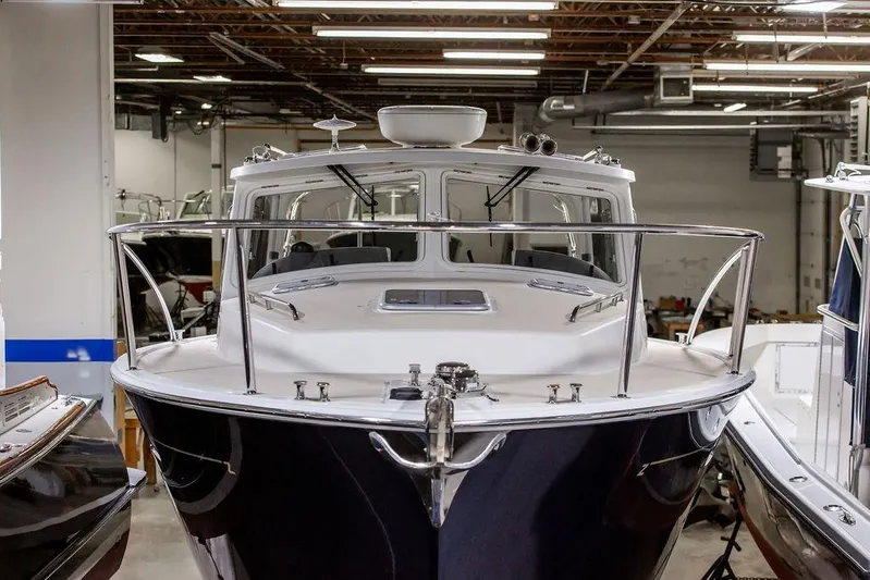 Mare Yacht Photos Pics 2018 MJM 35z boat in indoor storage, front view with sleek design and polished finish.