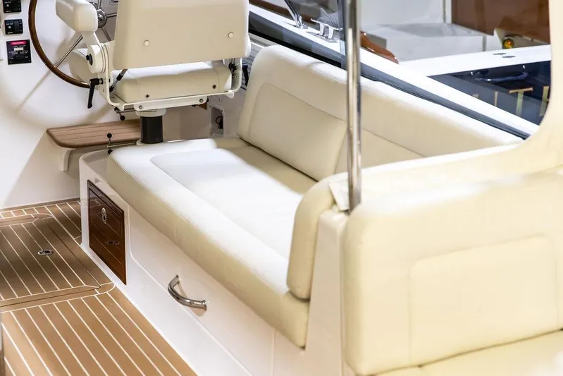 Mare Yacht Photos Pics 2018 MJM 35z boat interior with cream seating and wooden flooring.