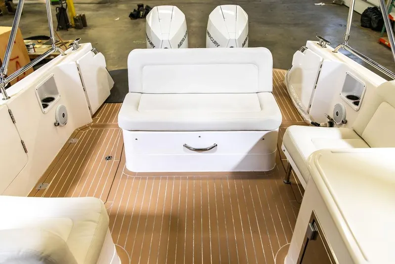 Mare Yacht Photos Pics 2018 MJM 35z boat interior with white seating and twin outboard engines.