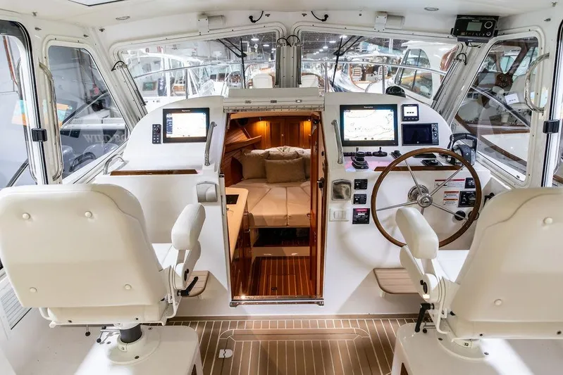 Mare Yacht Photos Pics Interior of 2018 MJM 35z boat with helm, navigation screens, and cabin view.
