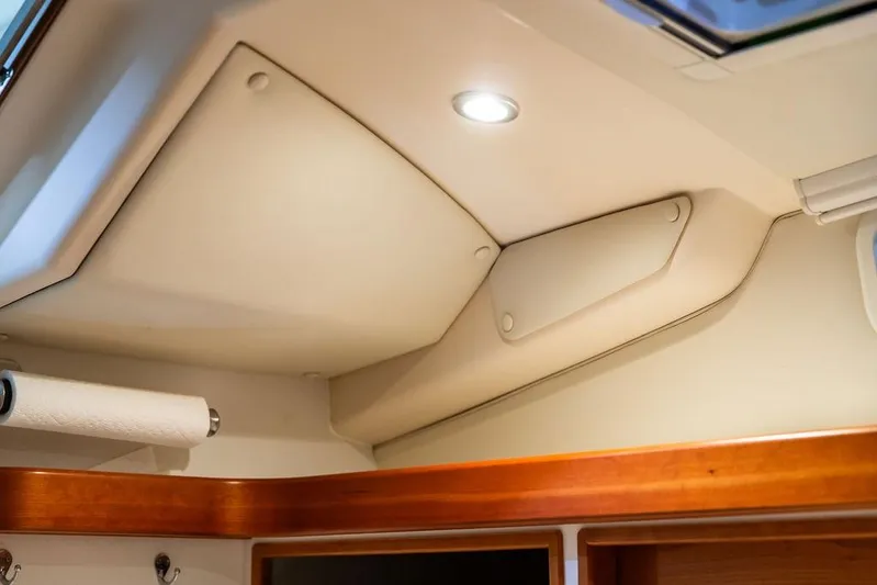 Mare Yacht Photos Pics Interior ceiling of 2018 MJM 35z boat with recessed lighting and wood trim.